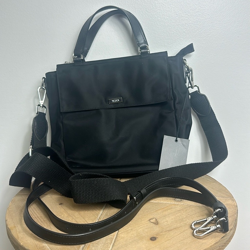 TUMI Kaylin Crossbody Nylon with leather fabric strap and leather strap.